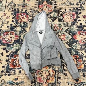 Grey women’s Converse zip up.